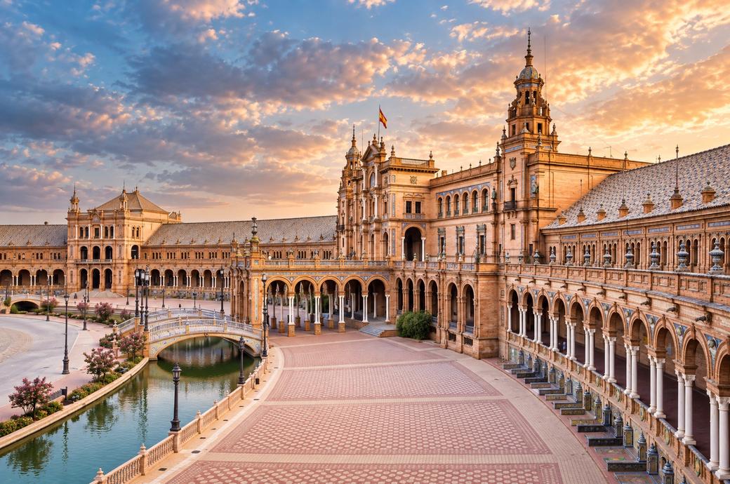 Plaza de España at sunset with its canal and arcade